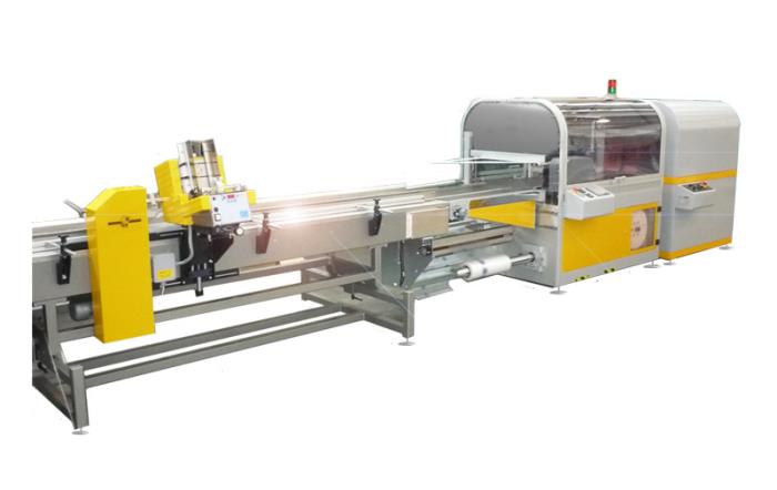 Shrink wrapping machines